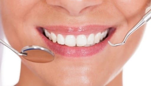 برای تقویت مینای دندان به طور منظم به دندانپزشک مراجعه کنید